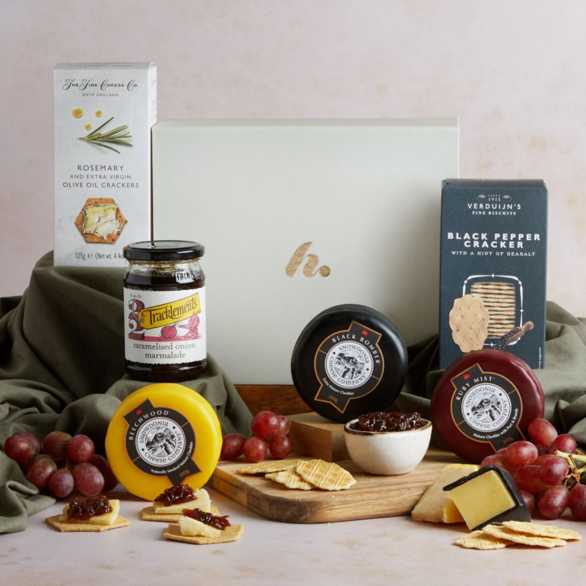 A trio of cheese truckles in a hamper