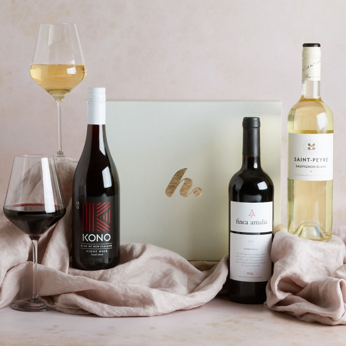 Wine Lovers Trio Gift Box with two bottles of red wine and one bottle of white wine on display