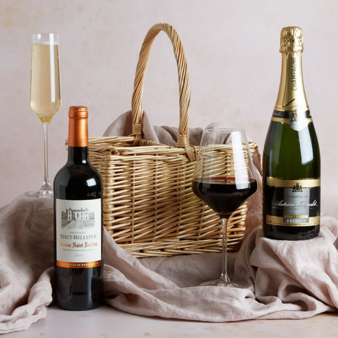  Luxury Champagne & Red Wine Hamper with contents on display